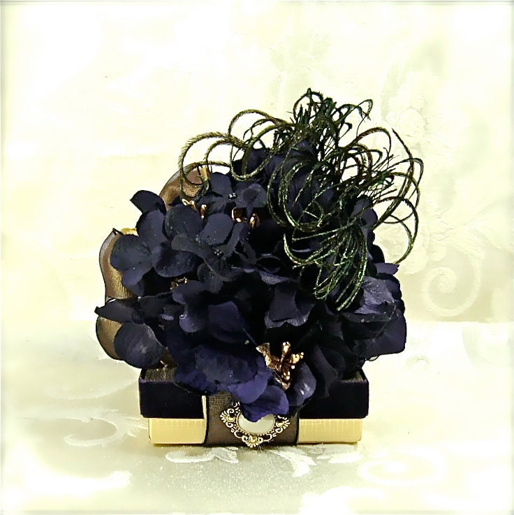 a gold mesh ribbon that is covered with a deep purple organza ribbon