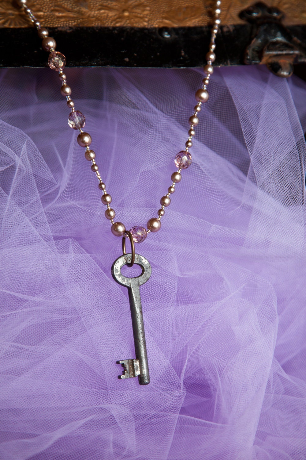 iridescent pink bead necklace with skeleton key