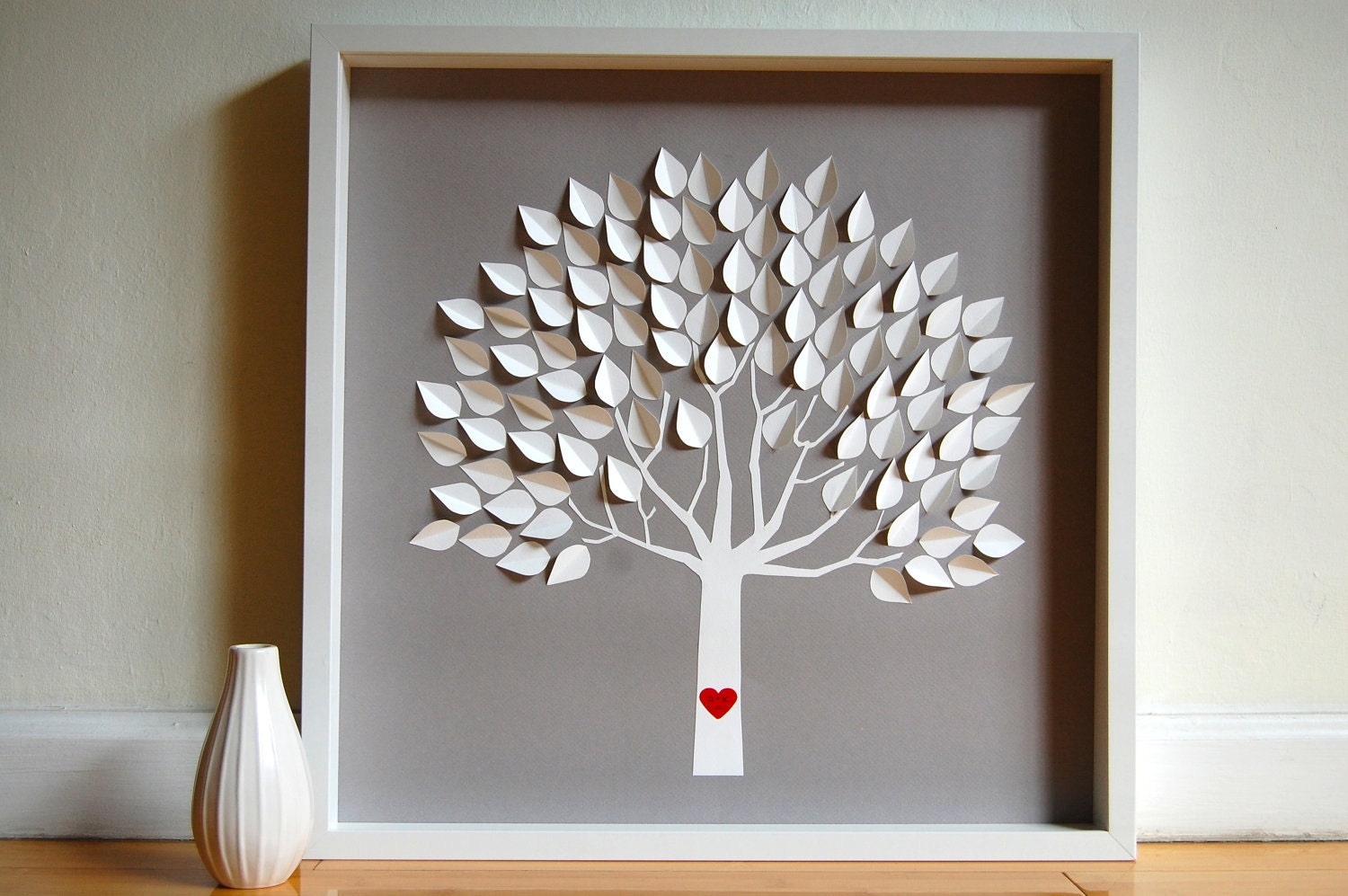 Framed personalized wedding tree with red heart on the trunk.