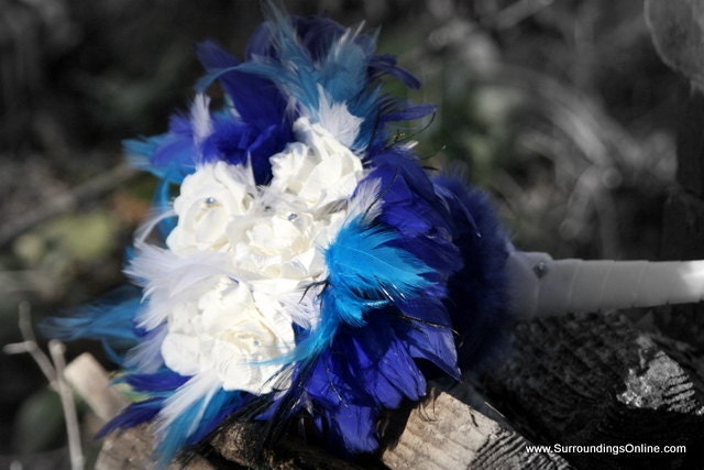 White Winter Wedding Bouquet with Royal Blue Feather Accents