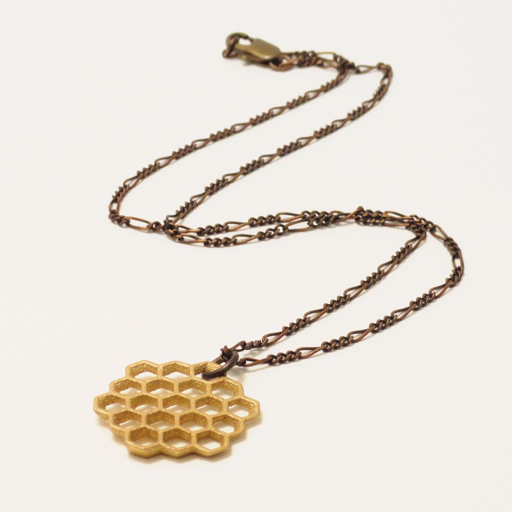 photograph of 'honeycomb slice pendant' with necklace chain