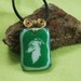 Sighthound Face on Green Glass