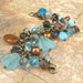 Browns and Aquas Antique Brass Charm Bracelet