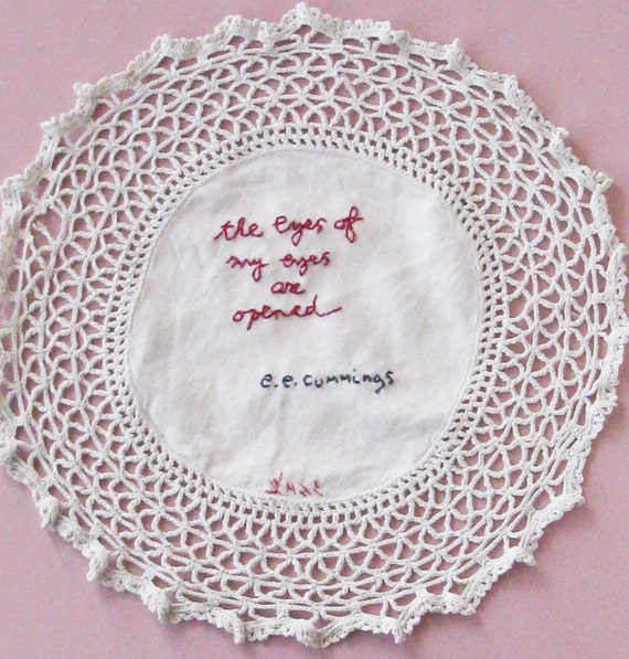 Hand embroidered textile art words by e.e. cummings