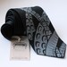 Sucker. Hand screen printed octopus necktie. (black silk)