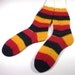 Hand knit adult socks -- Foot hugs in German national colors -- Regia World Ball wool blend yarn -- Germany socks