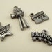 Four movie themed charms