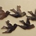 Silver coloured swallow bird charms