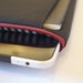 mattt - iPad & sketchbook sleeve - grey and black striped lining with a deep red zipper