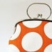Frame purse with handle big dots on orange