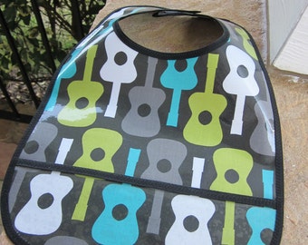 WATERPROOF WIPEABLE Baby to Toddler Plastic Coated Bib Groovy Guitars in Blue, Green and Gray