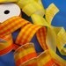 orange yellow wired ribbon assortment . 4 styles . 17 yards