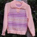 Girl, size 8, Peach/mauve striped sweater.