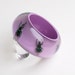 Pink lucite bangle with real insects