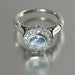 THE SECRET DELIGHT 14k gold Aquamarine engagement ring with White Sapphire halo