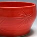 Small Red Bowl with Starburst Pattern