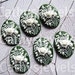 Portrait Cameos Six 18X13 White Floral on Green Background