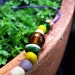 Beaded friendship bracelet in purple hemp with glass