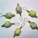 Owl Stitch Markers - Yellow and Green Ceramic Beads On Gold Wire Including Storage Tin - Set of 6 - US 10 - Item No. 708