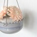 Hanging ikebana vase in baby blue.