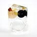 Clear resin ring with amber, gold and black resin