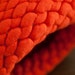 Wool felt knit pod vessel in bright orange and natural gray brown