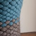 Wool felt knit pod vessel in slate blue and natural gray brown