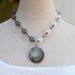 let light in . a hand stamped soul mantra locket