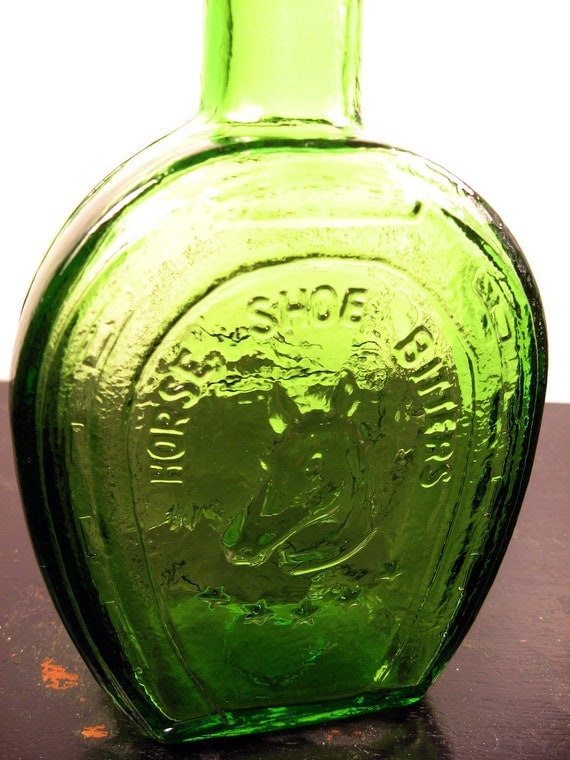 vintage green bitters medicine bottle
