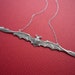 skinny bat necklace in silver