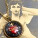 1920s Sacred Heart BUTTON necklace, Vintage glass on brass.