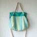 Aurelie Hobo Bag with Folded Top and Zipper Closure in European Linen Stripes in Turquoise