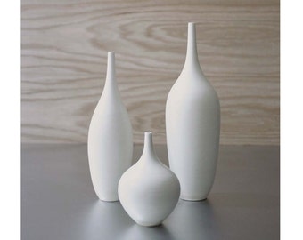 Trio of pure white ceramic bottle vases in modern matte white vessel bud vase by Sara Paloma Pottery. white vases mid century modern decor