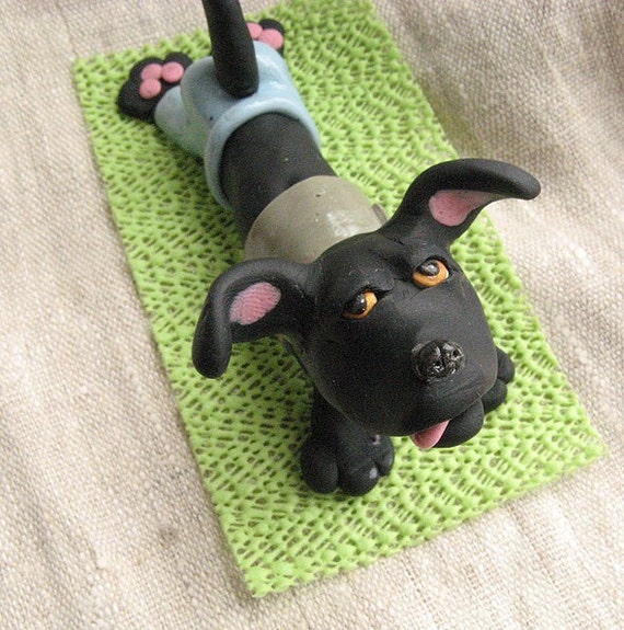 paw and tail yoga dog figurine