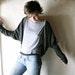 Long sleeved cardigan in grey knit jersey with striped accents