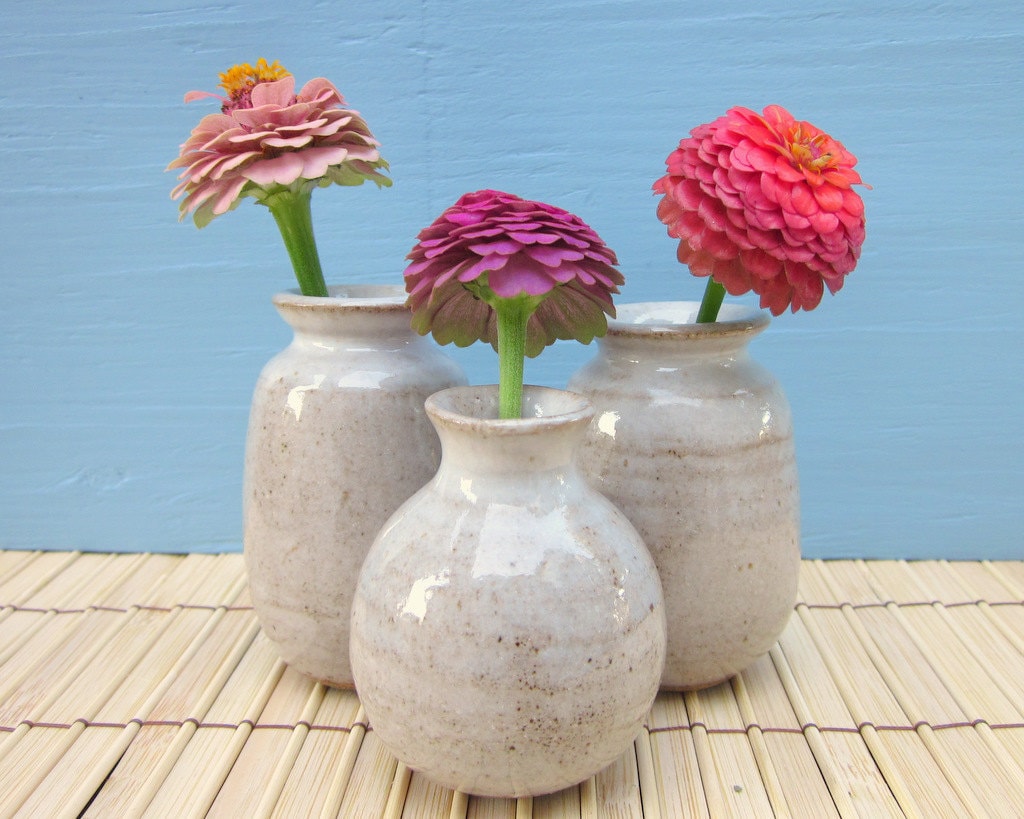 3 small white bud vases