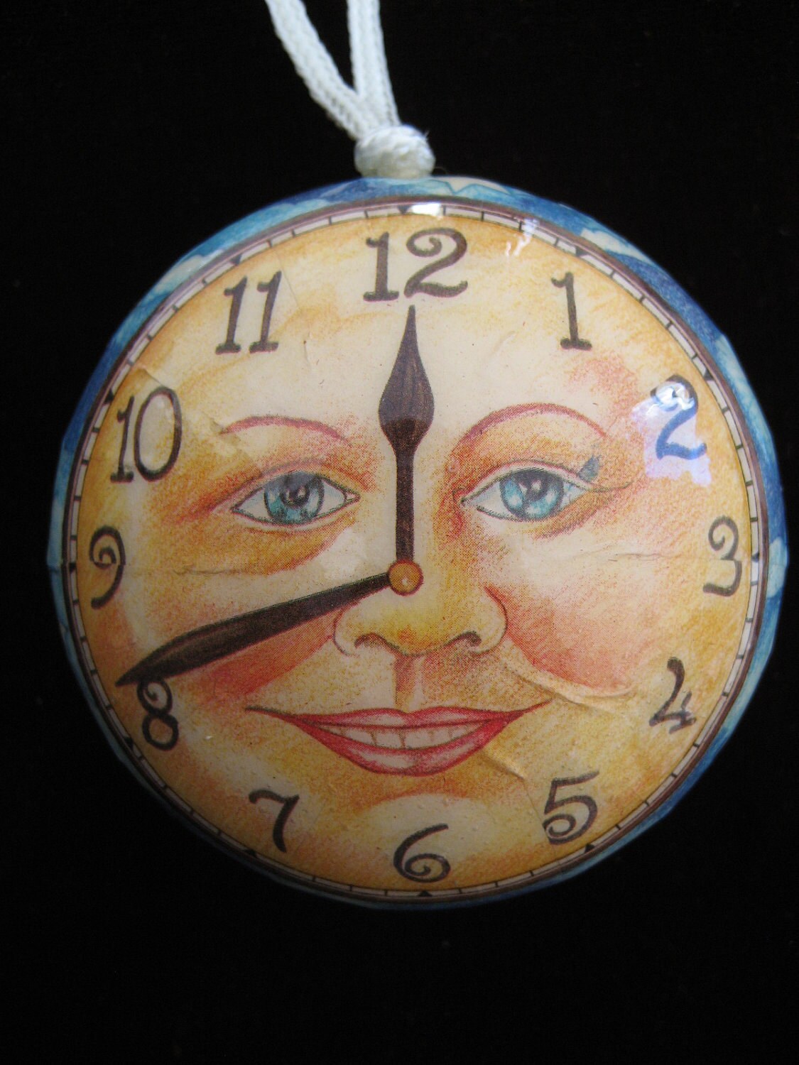 Man in the moon face clock ornament