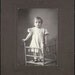 vintage photo Robert Gordon Fisher sr. Baby boy in dress on chair cabinet