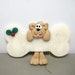 Dog hanging on a Bone polymer clay Ornament