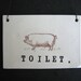 TOILET plaque (pig).