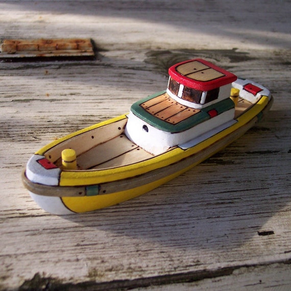 the yellow cedar wooden toy boat