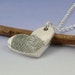 Fingerprint pendant. Your finger print hand engraved onto a sterling silver heart shaped pendant.