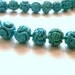 6 Turquoise Colored Carved Beads