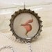 Whisper. Handcolored vintage image under resin in bottlecap necklace
