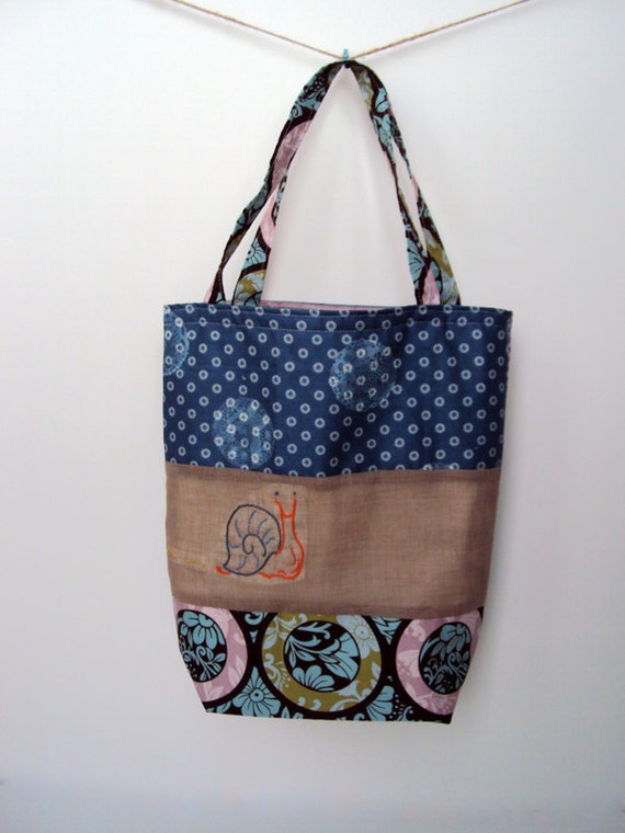 Items similar to Hand Embroidered Slate Blue Orange Snail Patchwork ...