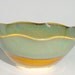 Scalloped Pottery Bowl in Amber with Sage Green and Blue around the Rim