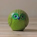 lime green round owl figurine