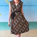 Batik-printed wrap dress in diagonal waves of black, ivory, tan, and navy, One of a kind