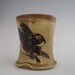 Mug with rabbits stoneware pottery