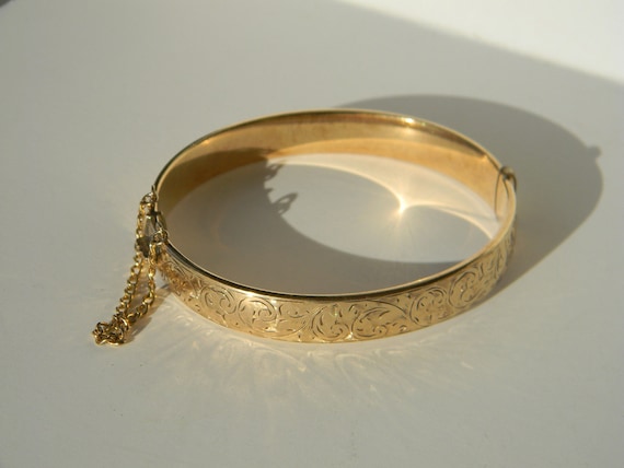Gold bangle bracelet with safety chain bracelet